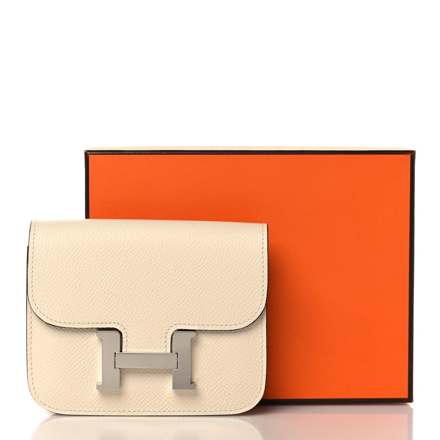 Slim Constance wallet in Nata textured leather with front clasp, orange box