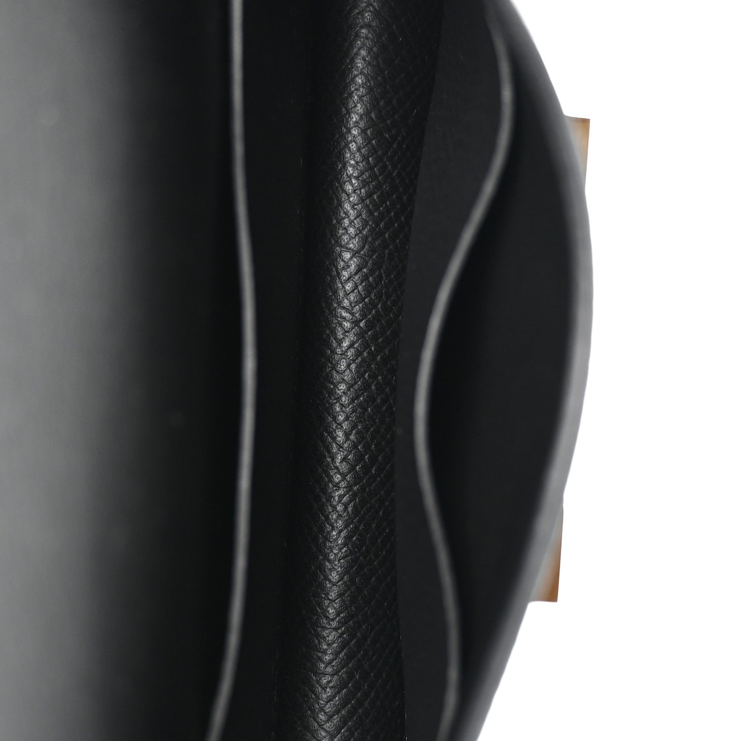 Hermes Constance slim wallet black leather edge close-up with contrast stitching