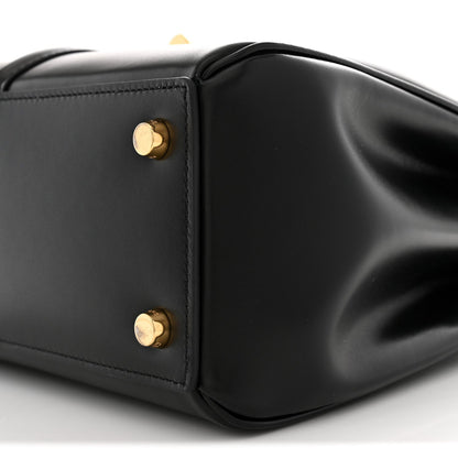 Black leather corner with two gold snap studs and smooth satin finish