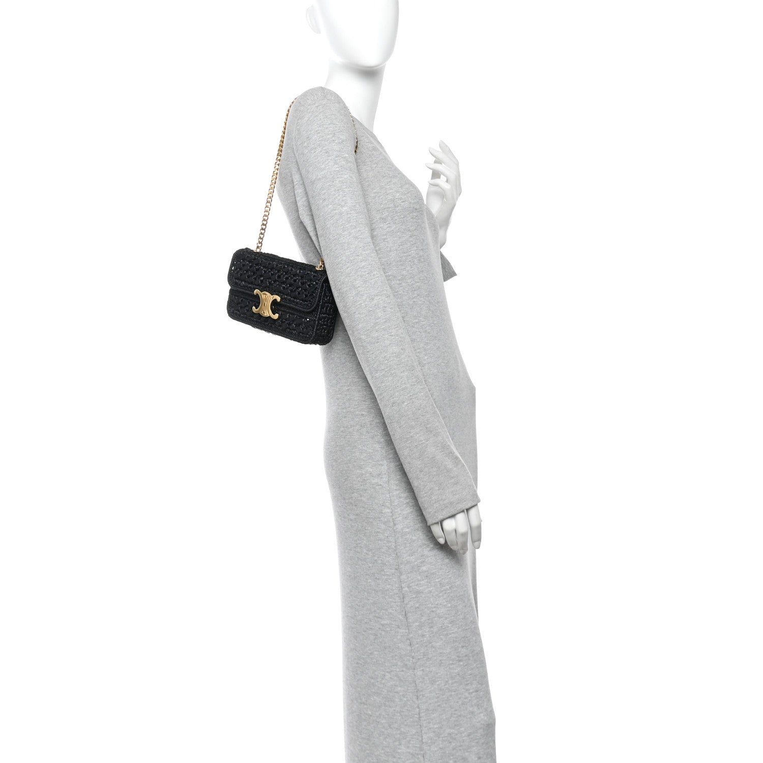 Black chain shoulder bag with gold CC logo, worn crossbody on a model