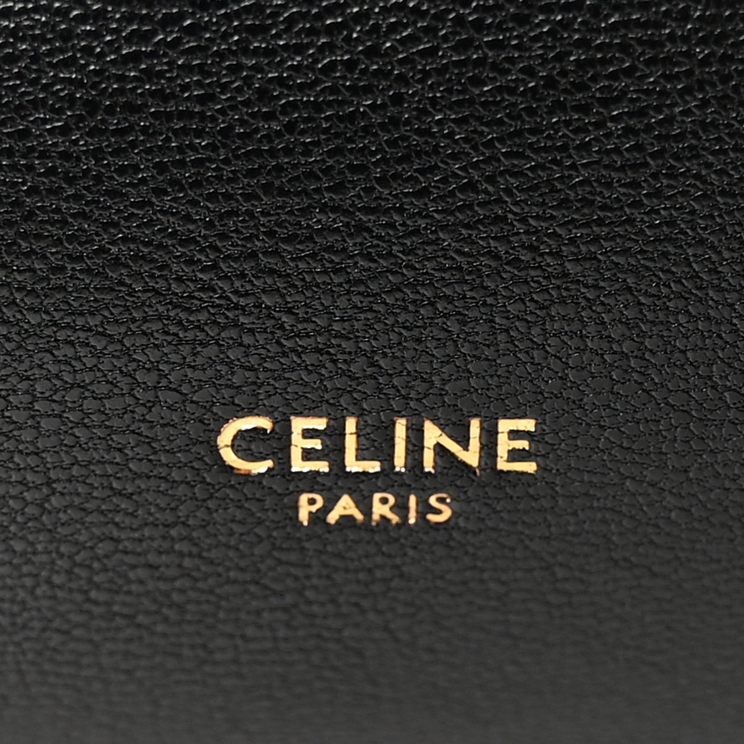Black leather bag with CELINE PARIS logo embossed.