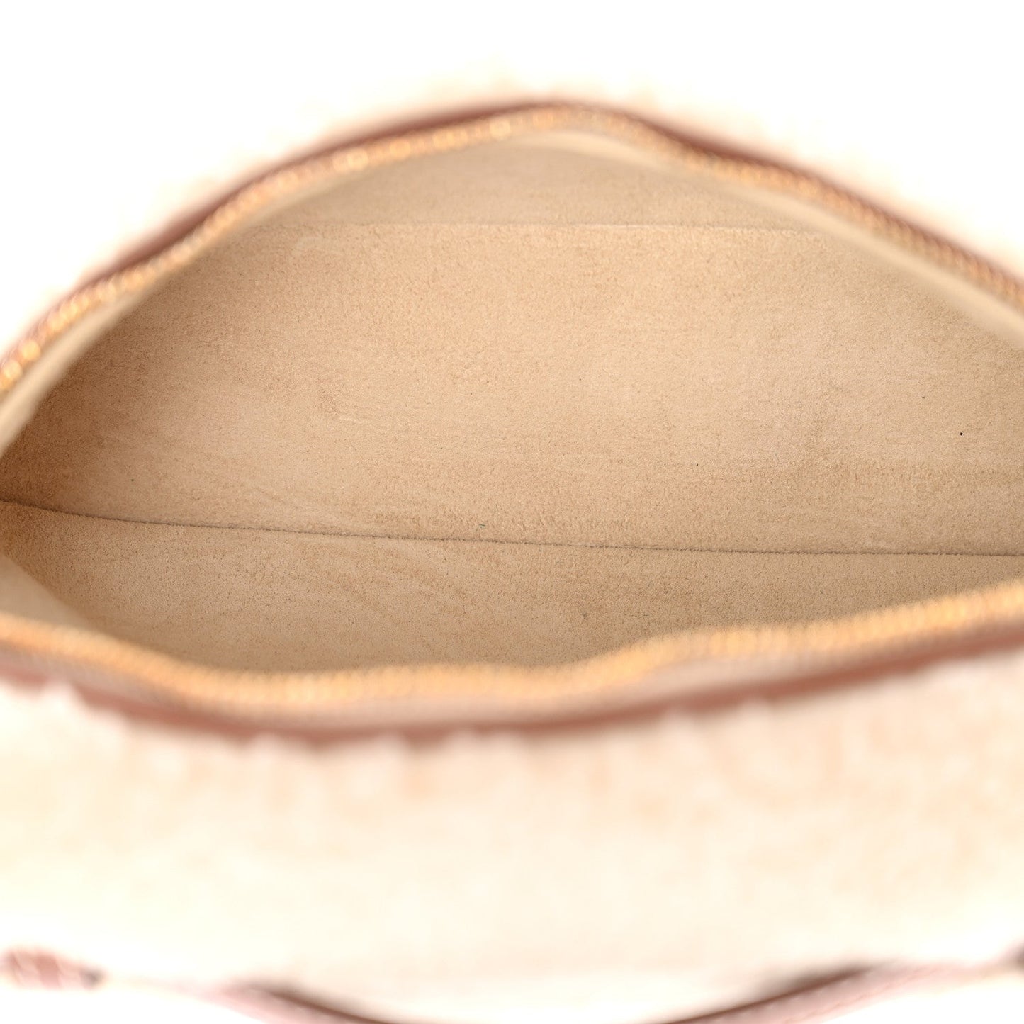 Cream faux-fur pouch interior lining with top zipper opening