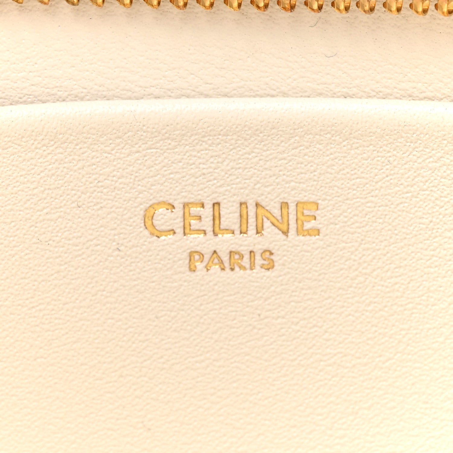 Celine Paris text on light rice cream leather with zipper edge