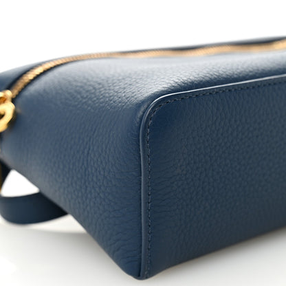 Navy grained calfskin pouch corner with detailed edge stitching