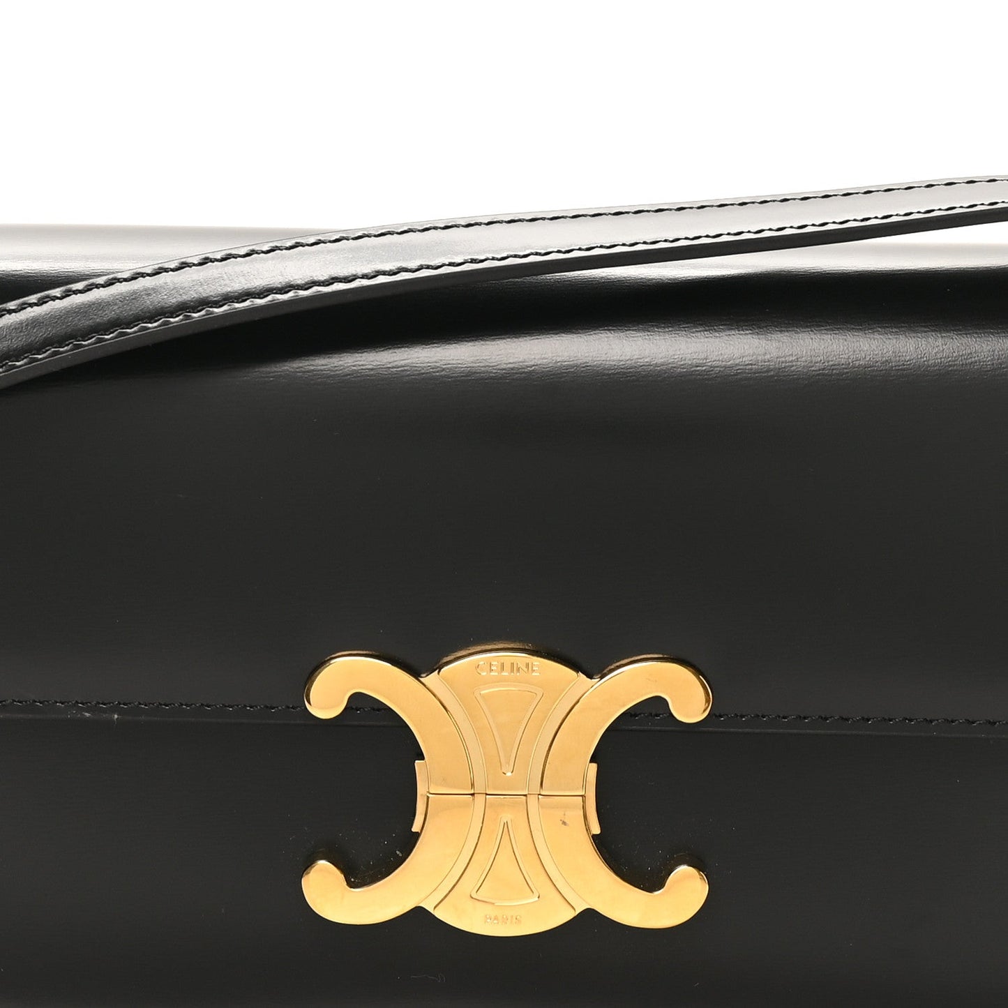 Gold-tone Triomphe logo centered on black shiny leather shoulder bag front