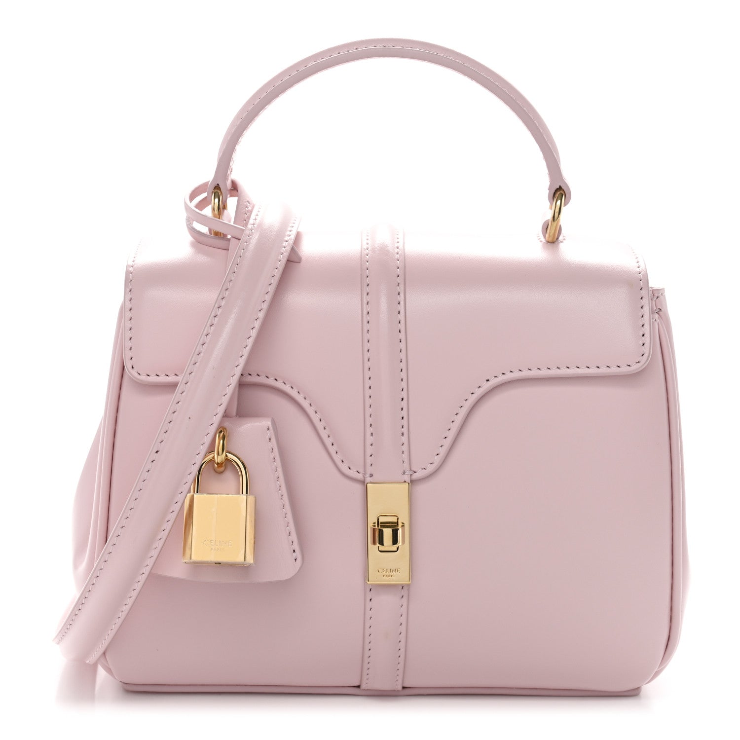 Pastel pink mini top-handle bag with flap front, gold lock detail, and shoulder strap