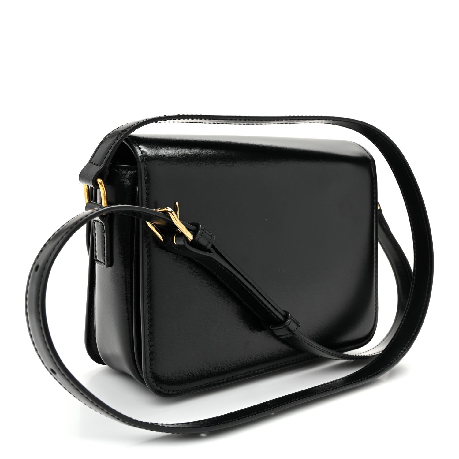 Black shiny shoulder bag with gold hardware and adjustable crossbody strap, flap closure.
