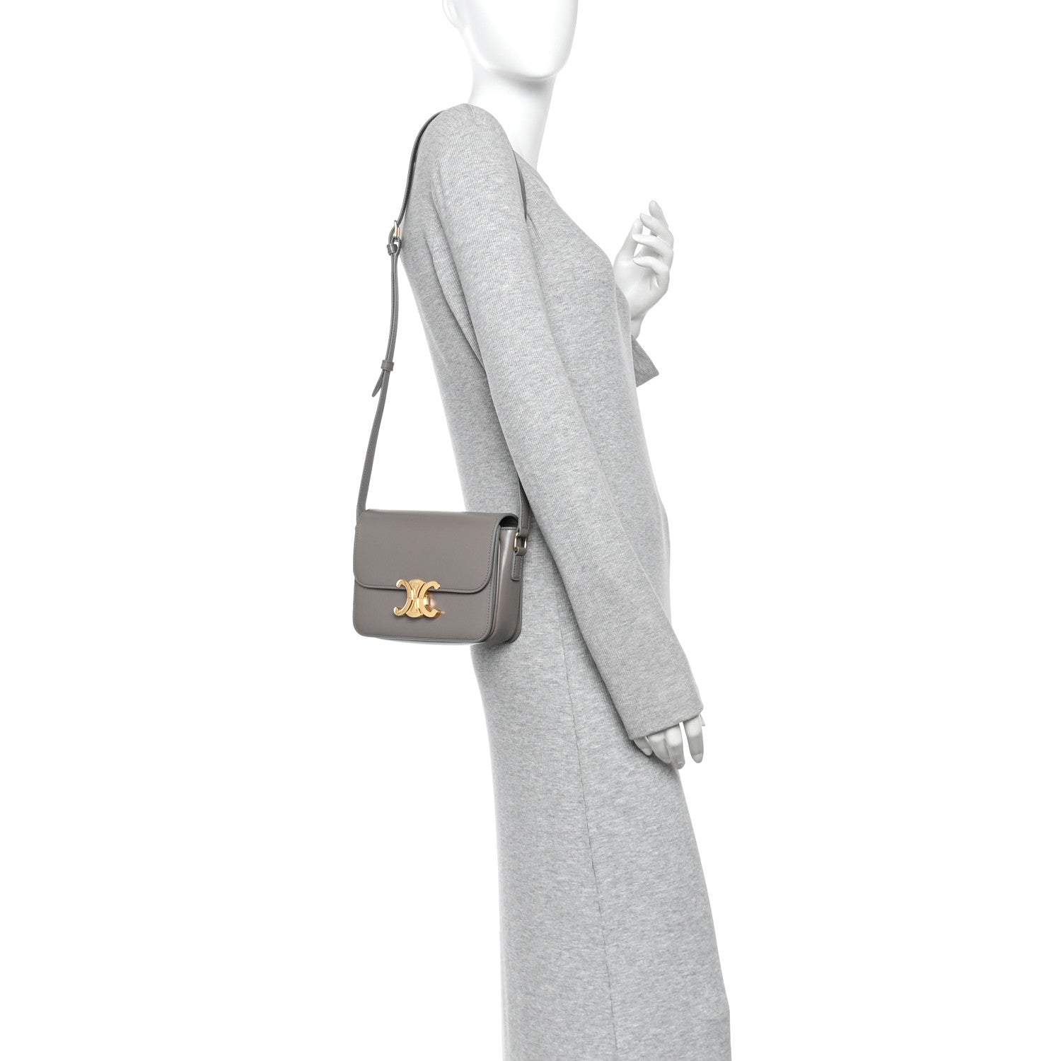 Celine shiny calfskin shoulder bag on model, light gray with gold-tone logo