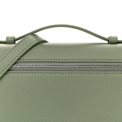 Sage green leather pouch front with top zipper and strap attachment