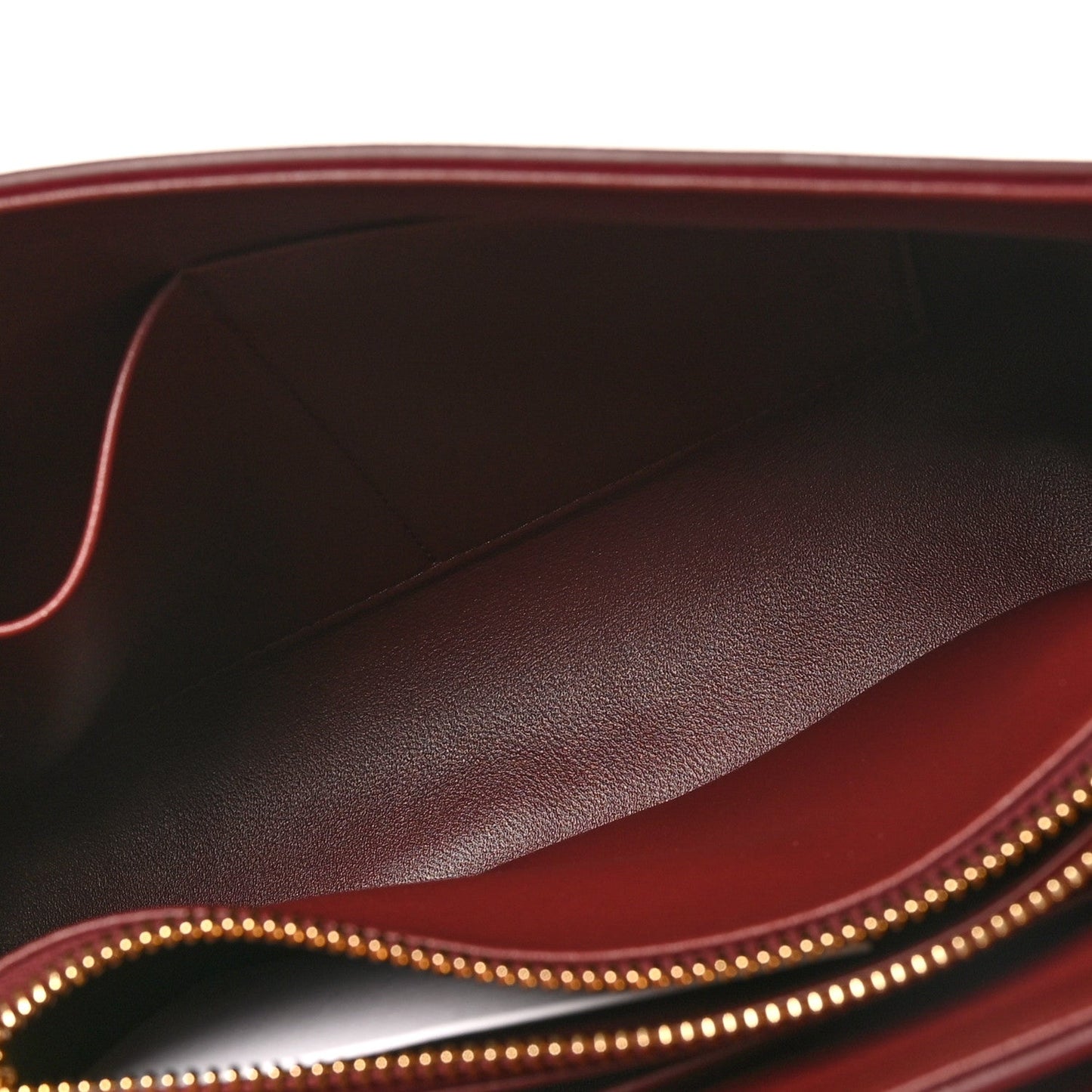 Celine burgundy leather interior with stitched lining and gold zipper trim