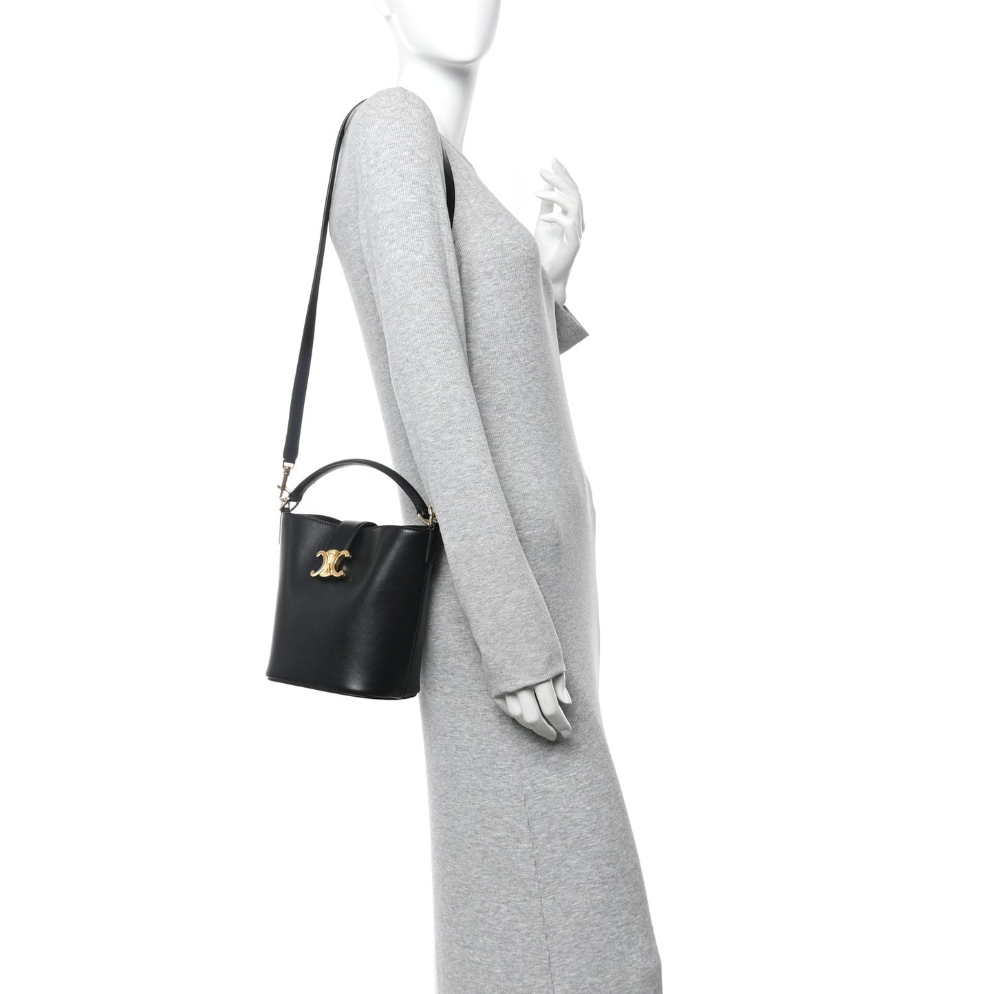 Small black Celine bag on shoulder strap, gold logo detail, smooth leather finish