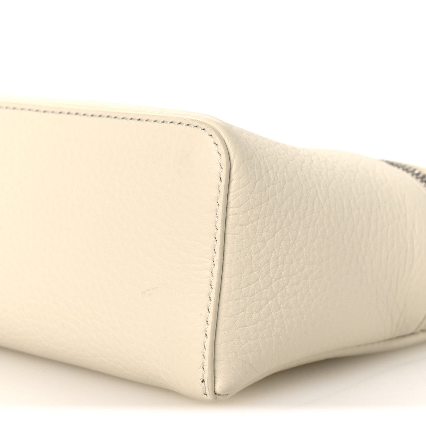 White grained calfskin pouch corner detail with topstitching, close-up
