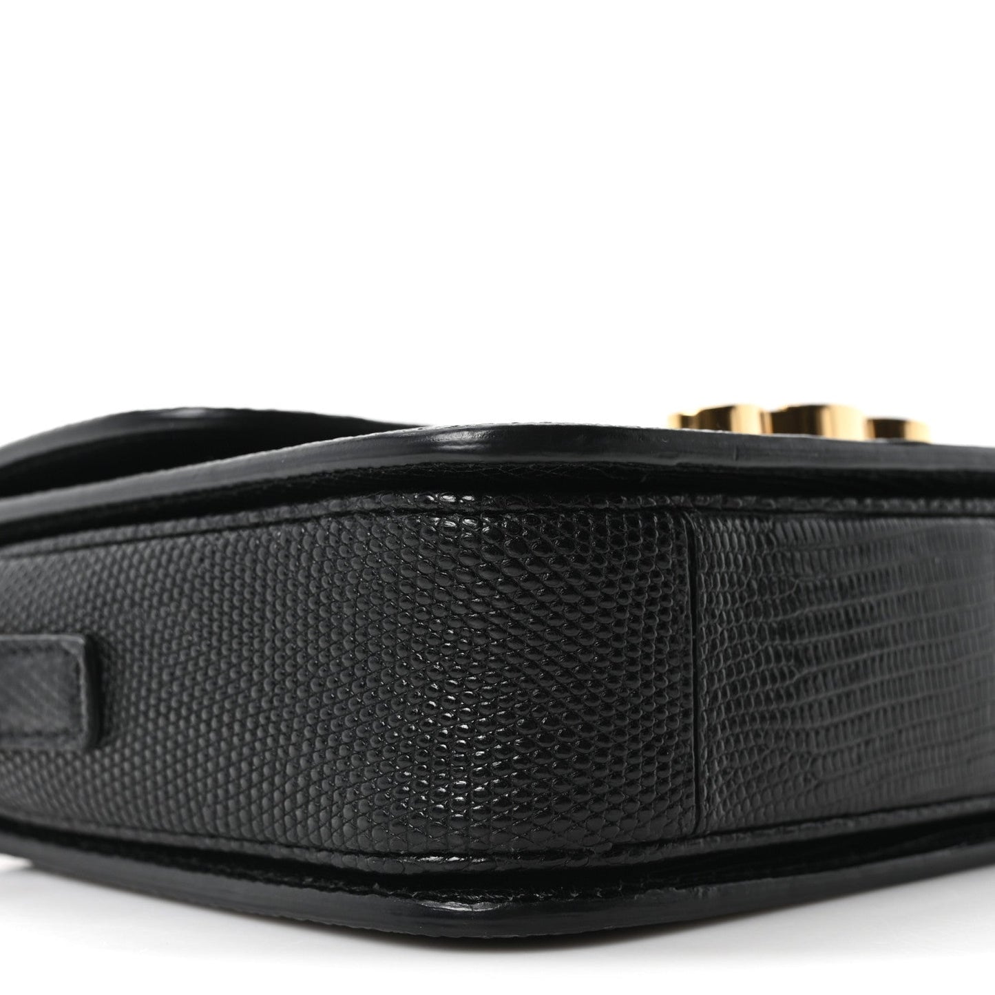 Black lizard-embossed side panel of flap shoulder bag