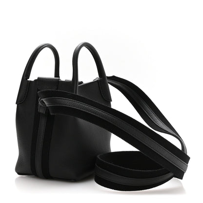 Black grained leather micro bale bag with two top handles and long crossbody strap