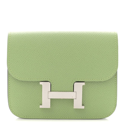 Light green leather slim wallet with front H clasp and top flap