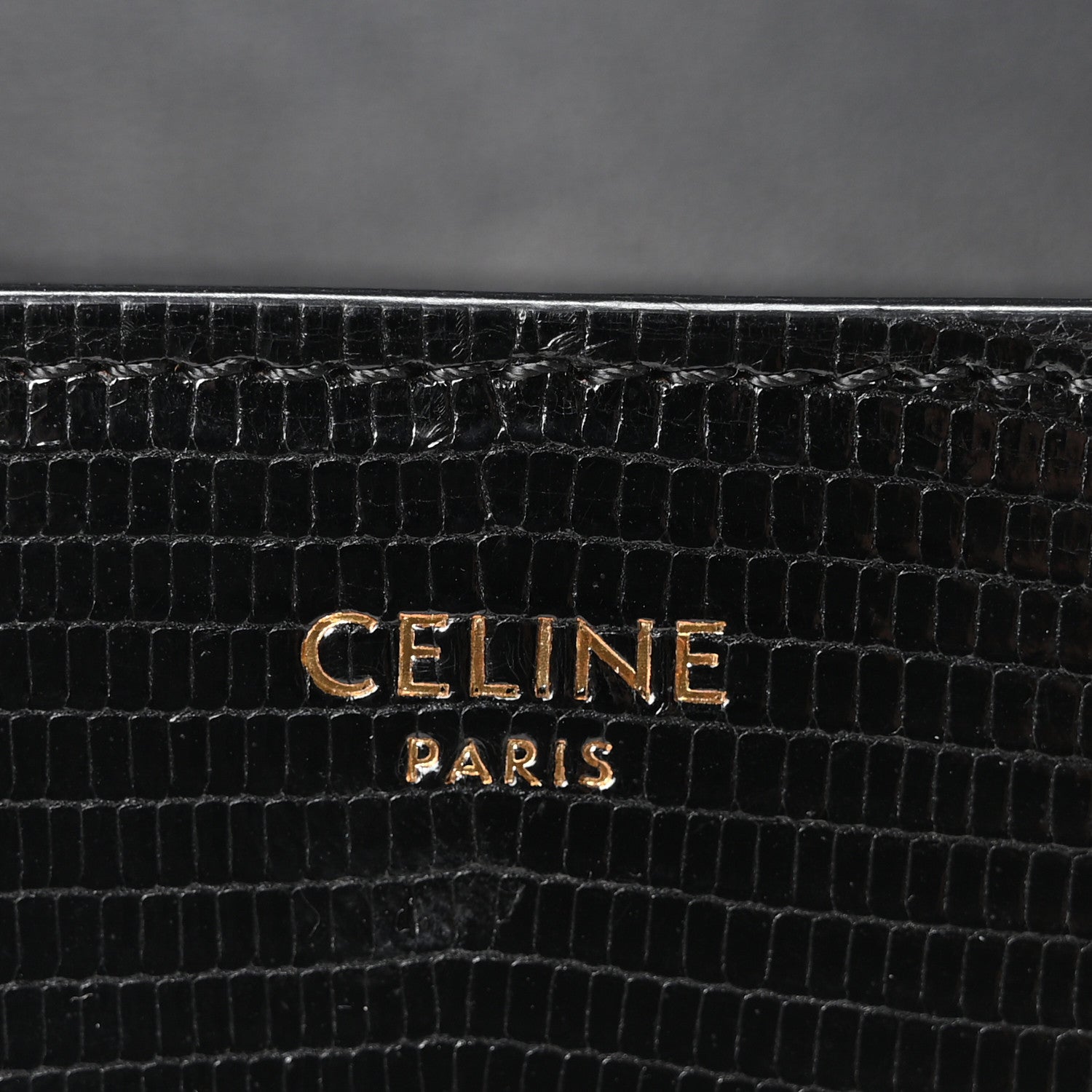 Black lizard-embossed leather with gold CELINE PARIS stamp