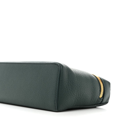Dark green grained leather pouch with rounded base seam and zipper trim.