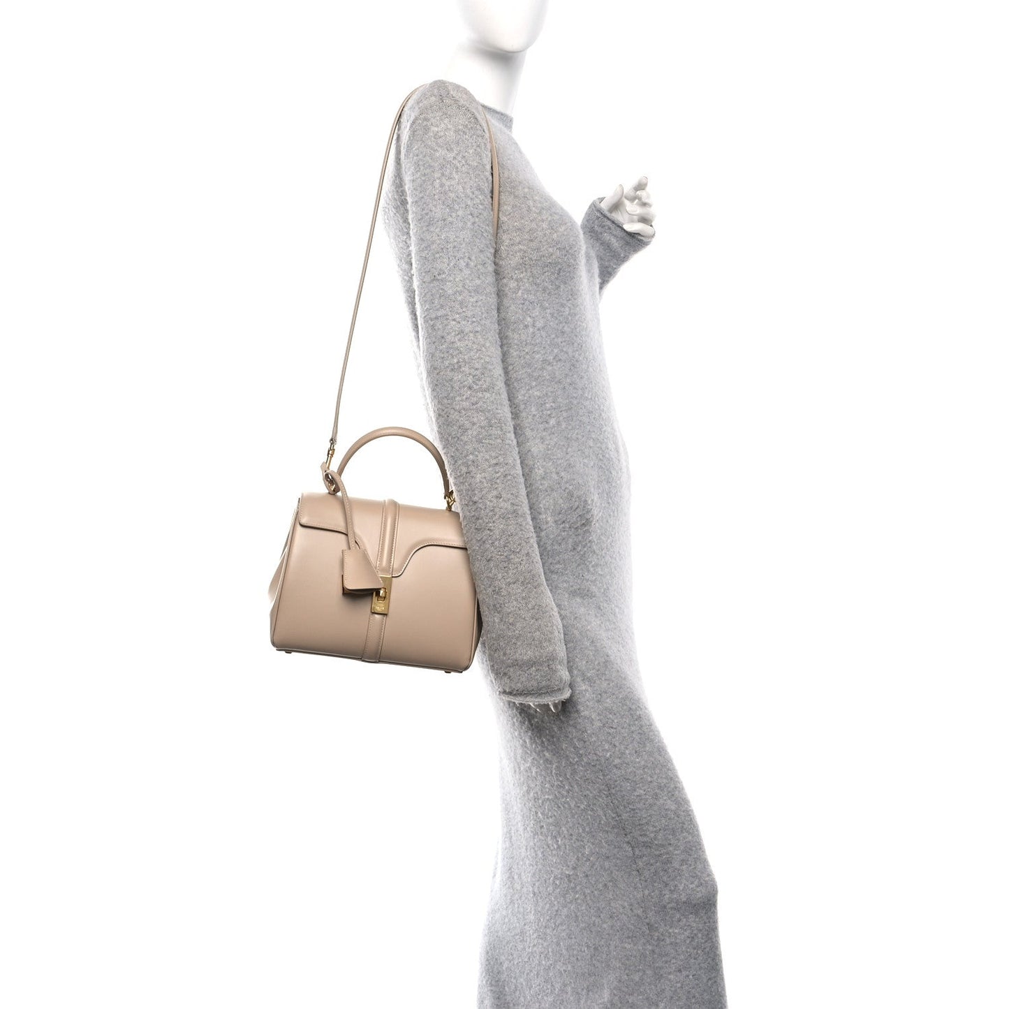 Small nude top-handle bag with shoulder strap and crossbody strap, gold hardware