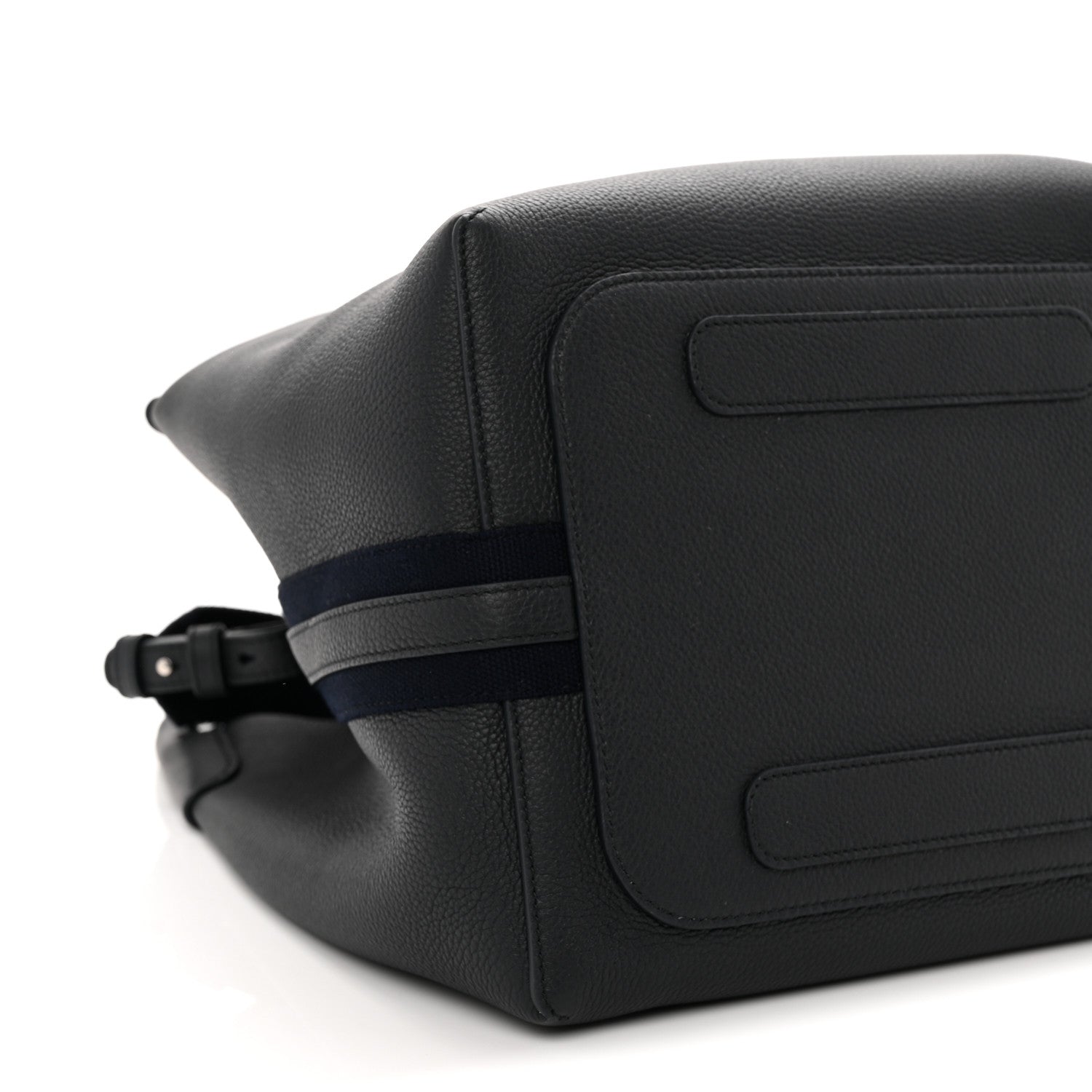 Dark navy leather bag exterior close-up with flap panel and adjustable belt strap
