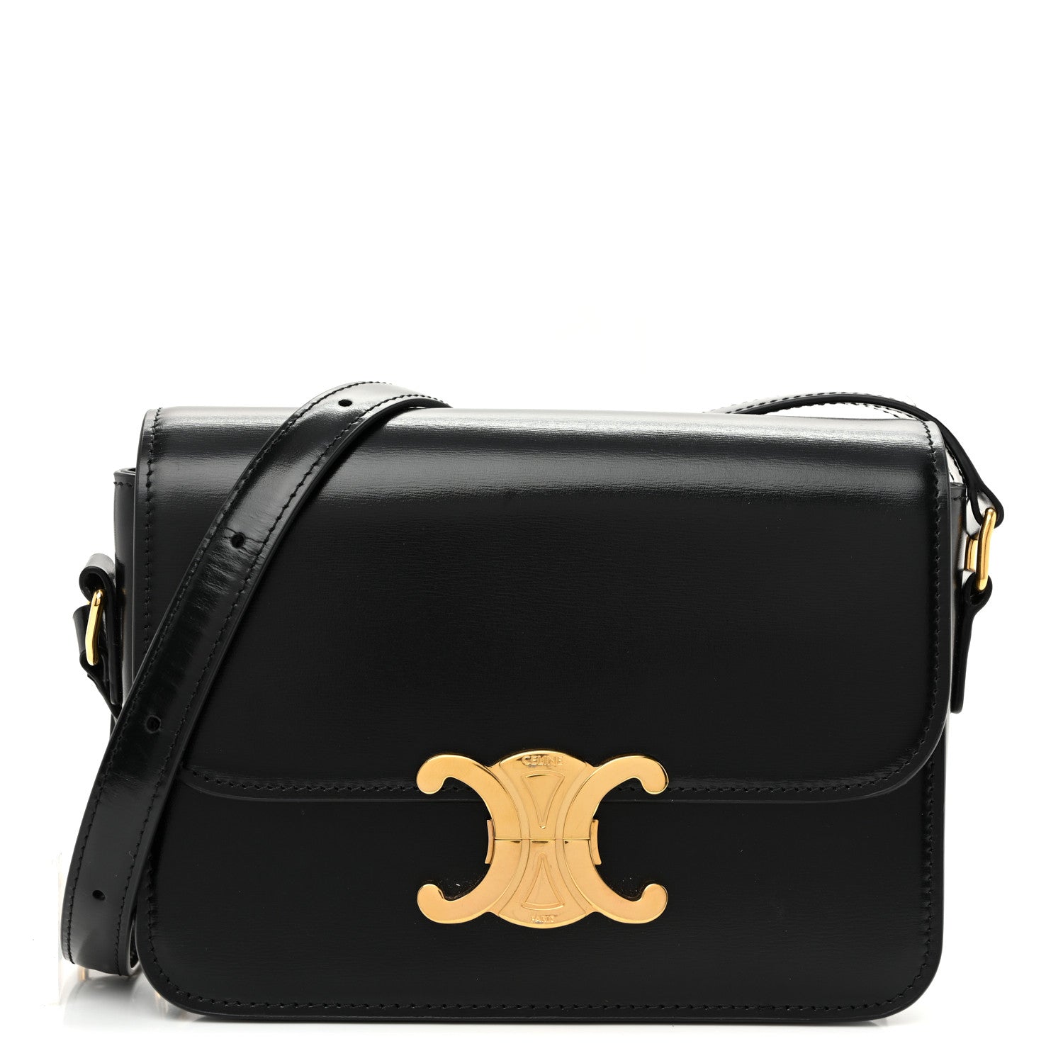 Black shiny calfskin shoulder bag with gold logo and top flap, adjustable strap.