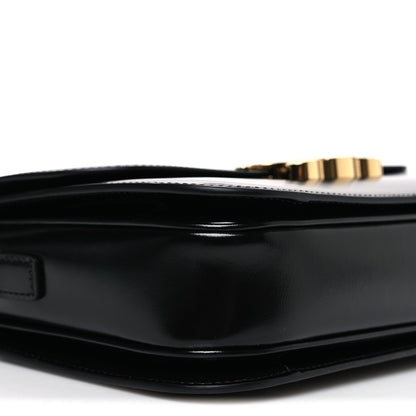 Shiny calfskin medium shoulder bag top interior close-up with gold zipper pull