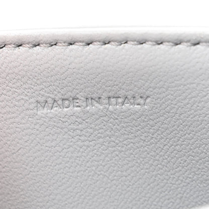 Shiny calfskin bag interior label reading MADE IN ITALY