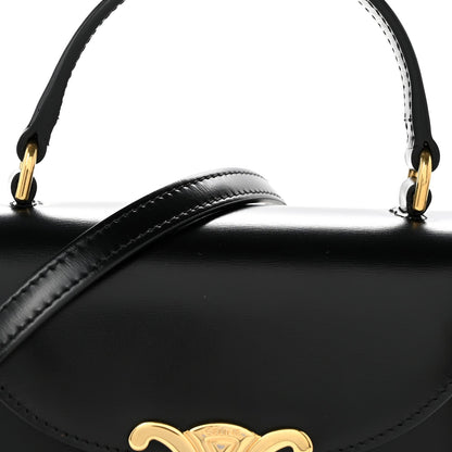 Black shiny mini crossbody bag with Triomphe logo front and gold-tone top hardware