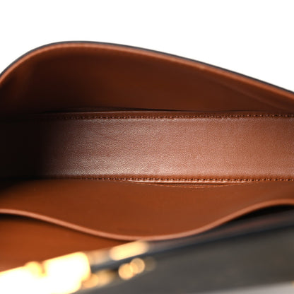 Celine bag interior with brown leather lining and stitched edge
