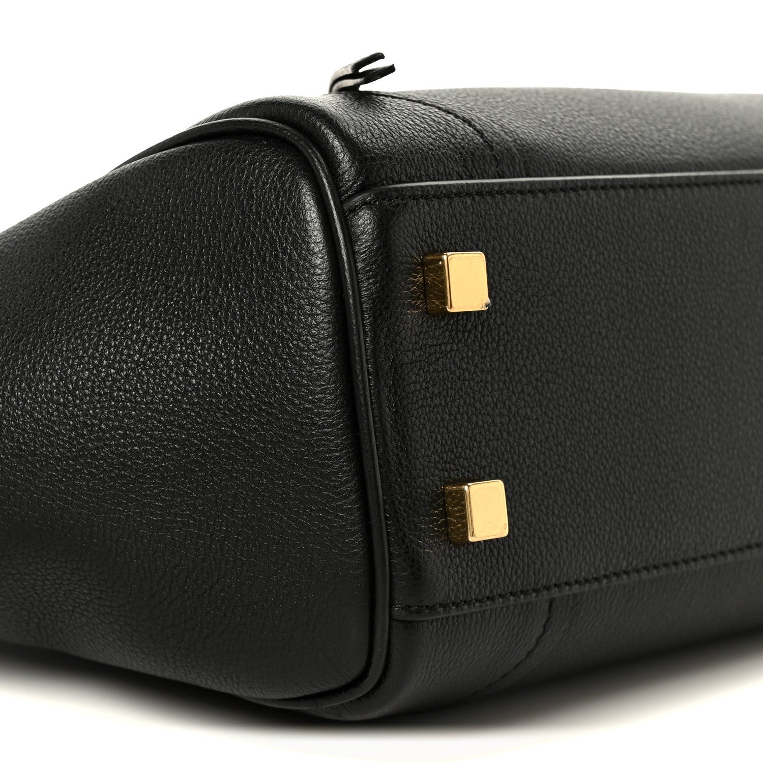Black grained calfskin tote end with gold buckle tabs and structured sides