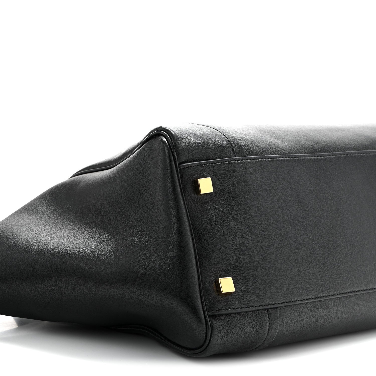 Celine black leather tote corner detail with two gold hardware studs