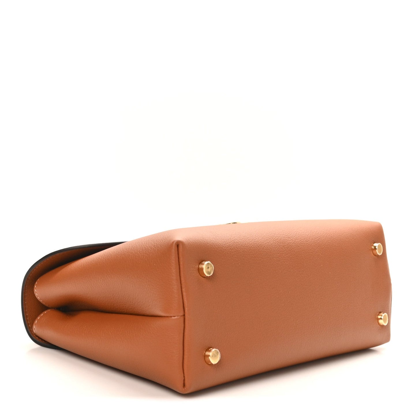 Tan leather medium handbag with structured base and gold corner studs, side seam detail