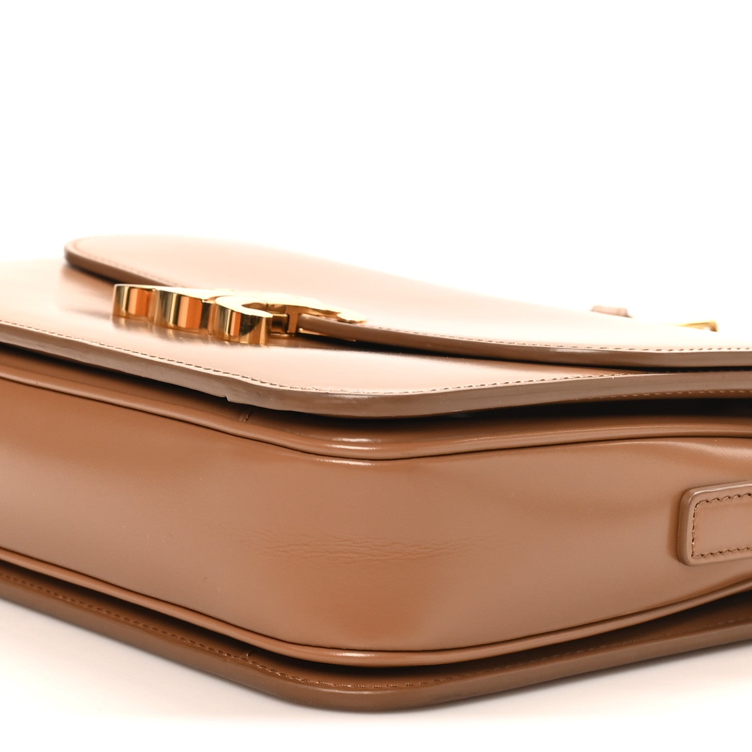 Bronze top edge with gold-tone hardware and structured corner