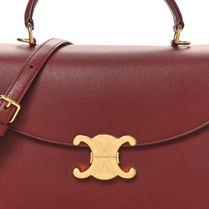 Celine burgundy grained leather shoulder bag front with gold logo emblem and strap