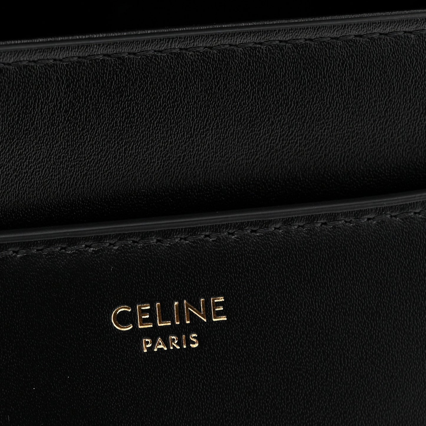 Black leather with CELINE PARIS embossed branding and subtle stitching detail