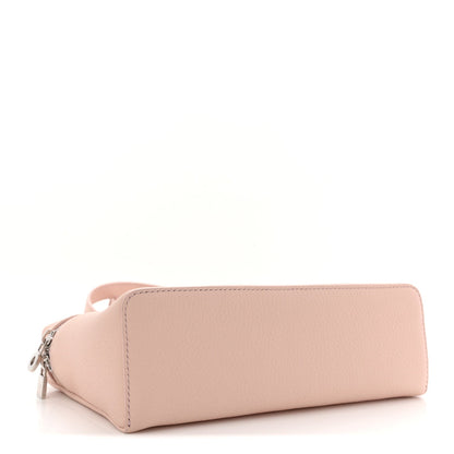 Light pink grained leather pouch with long zipper and top handle
