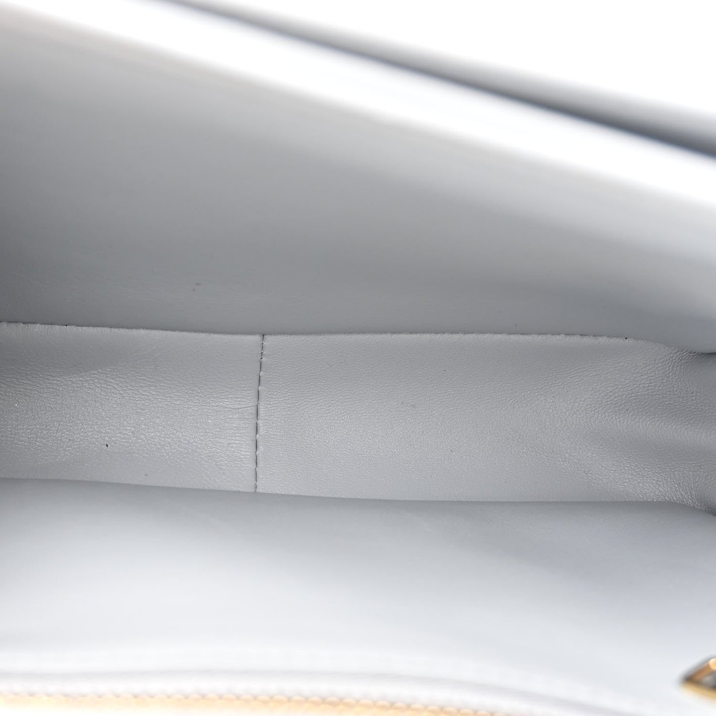 Shiny calfskin bag interior seam and lining close-up