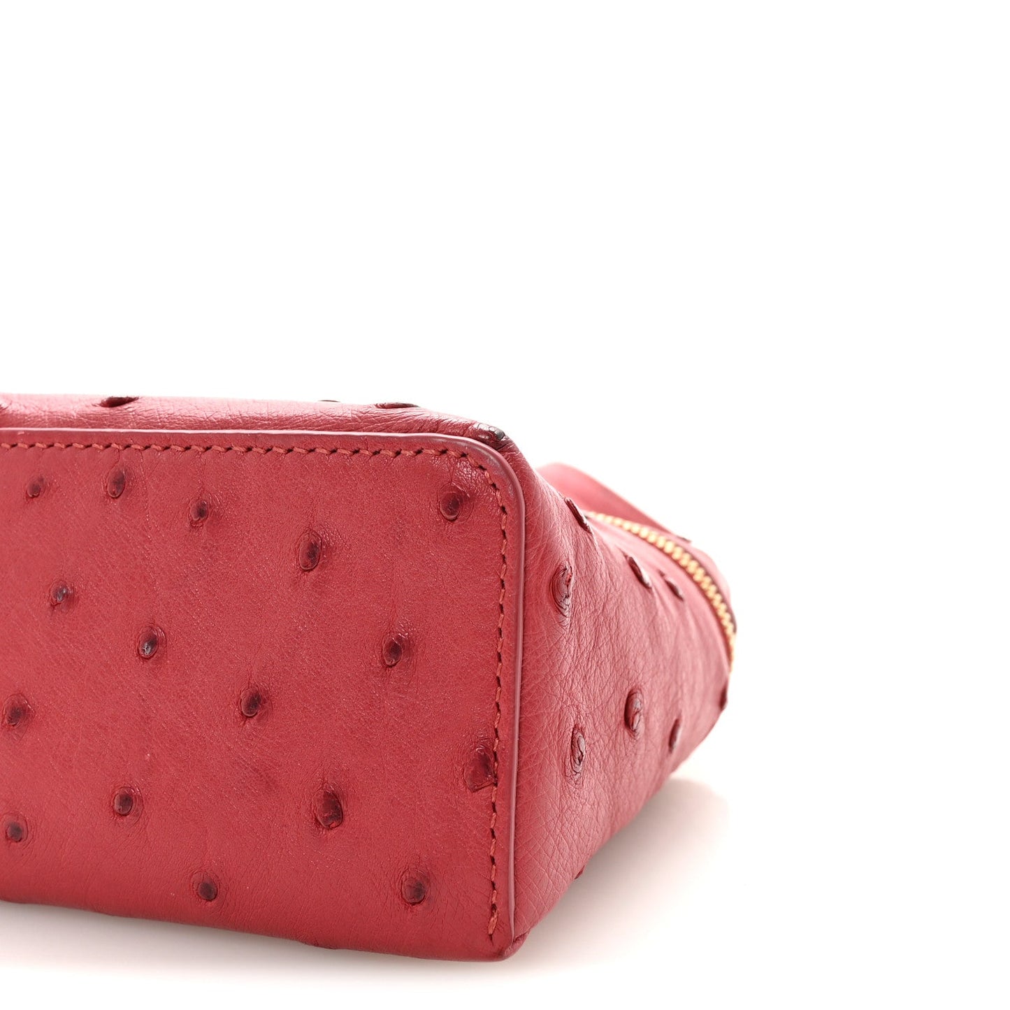 Loro Piana ostrich pouch fuchsia, end panel with structured stitching and gold zipper edge