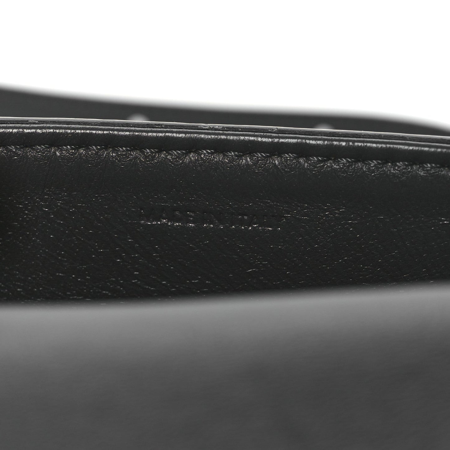 Close-up of black leather strap and grey snakeskin edge stitching