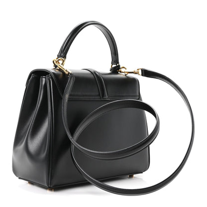 Celine mini top-handle bag in black leather with gold chain strap and front flap