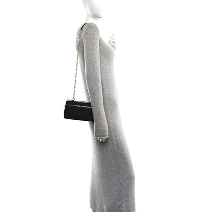 Black nubuck pouch with chain strap and top handle, side view