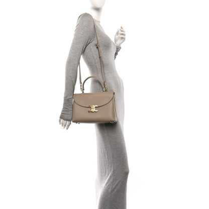 Beige grained calfskin Nino safari bag with shoulder strap and gold logo