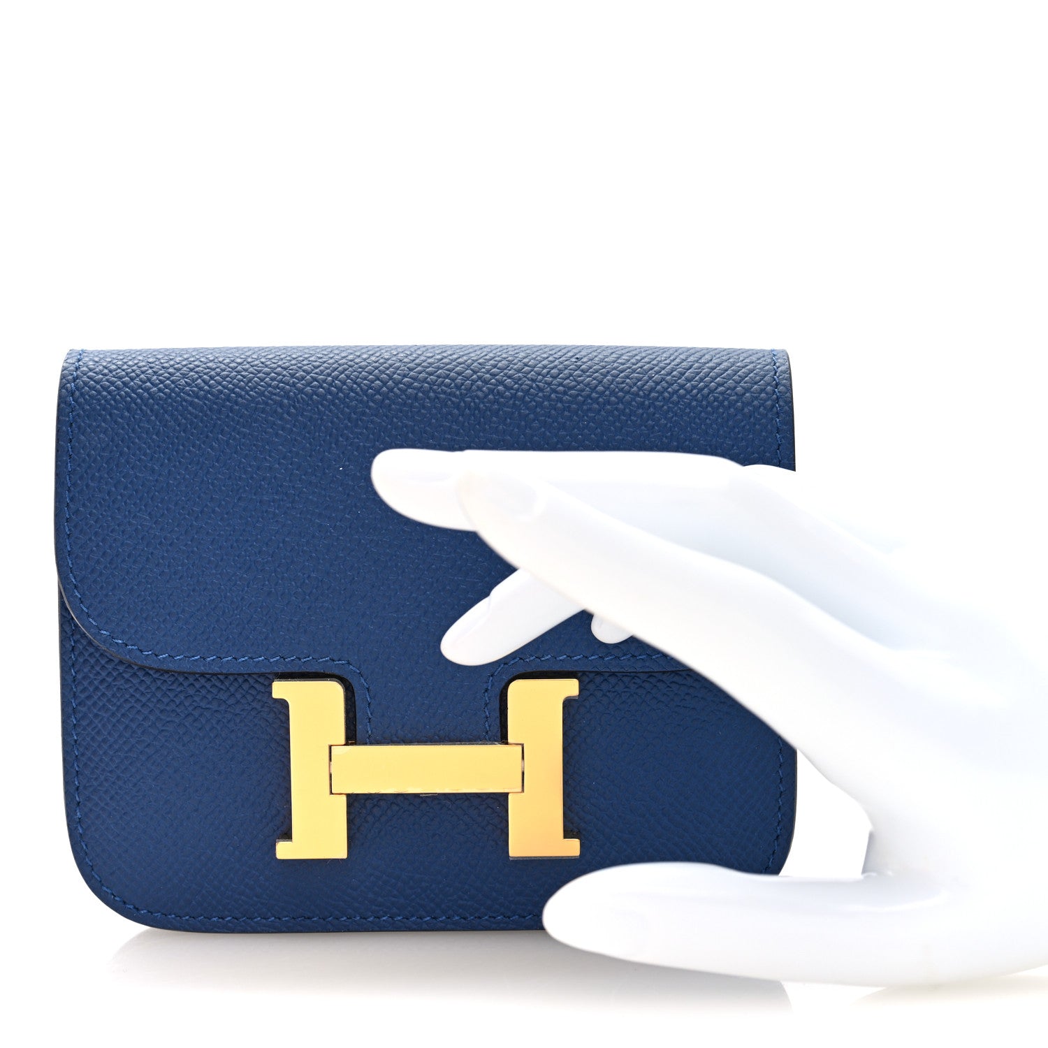 Blue slim wallet front with gold H logo clasp and white glove