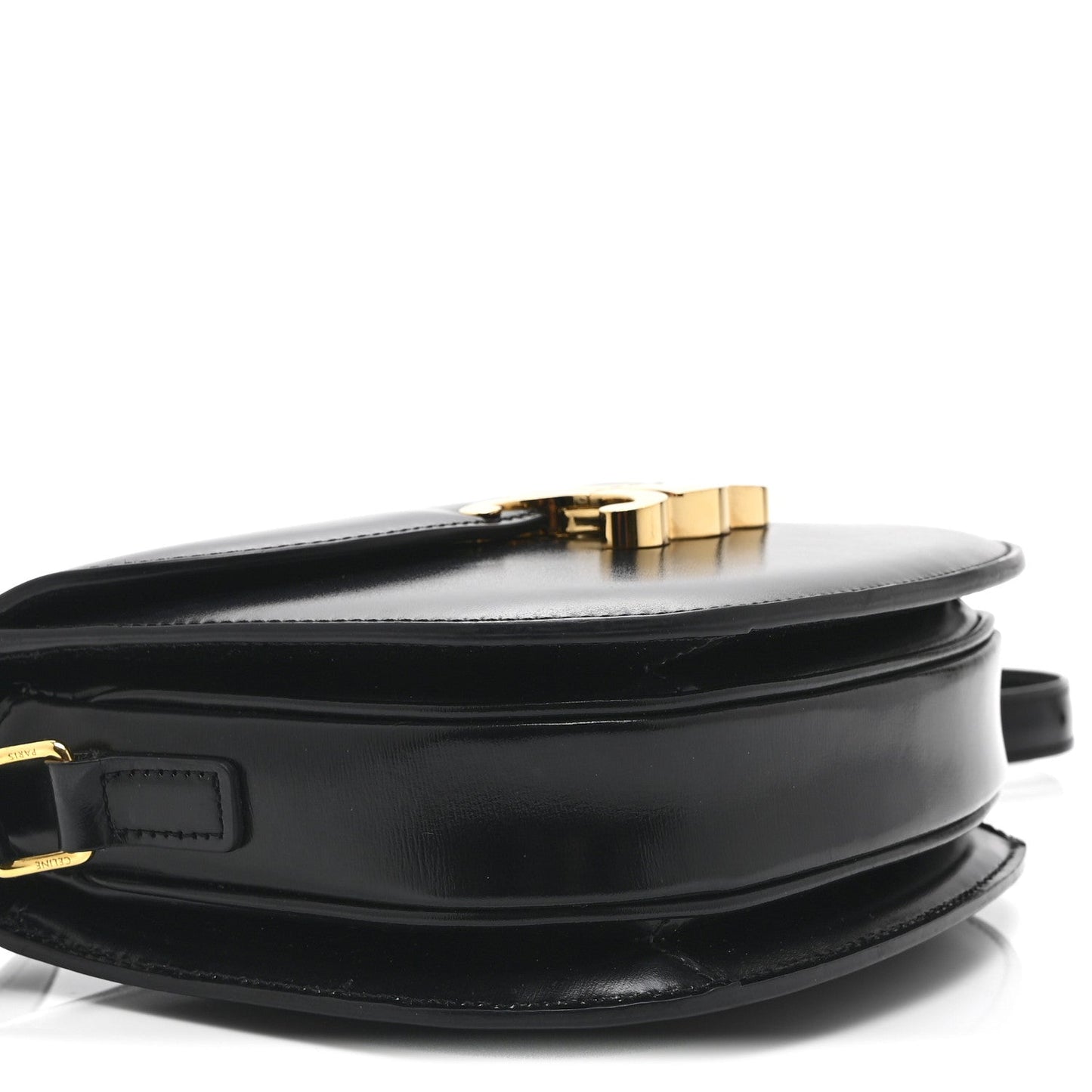 Black leather crossbody bag with gold-tone top clasp and front strap detail