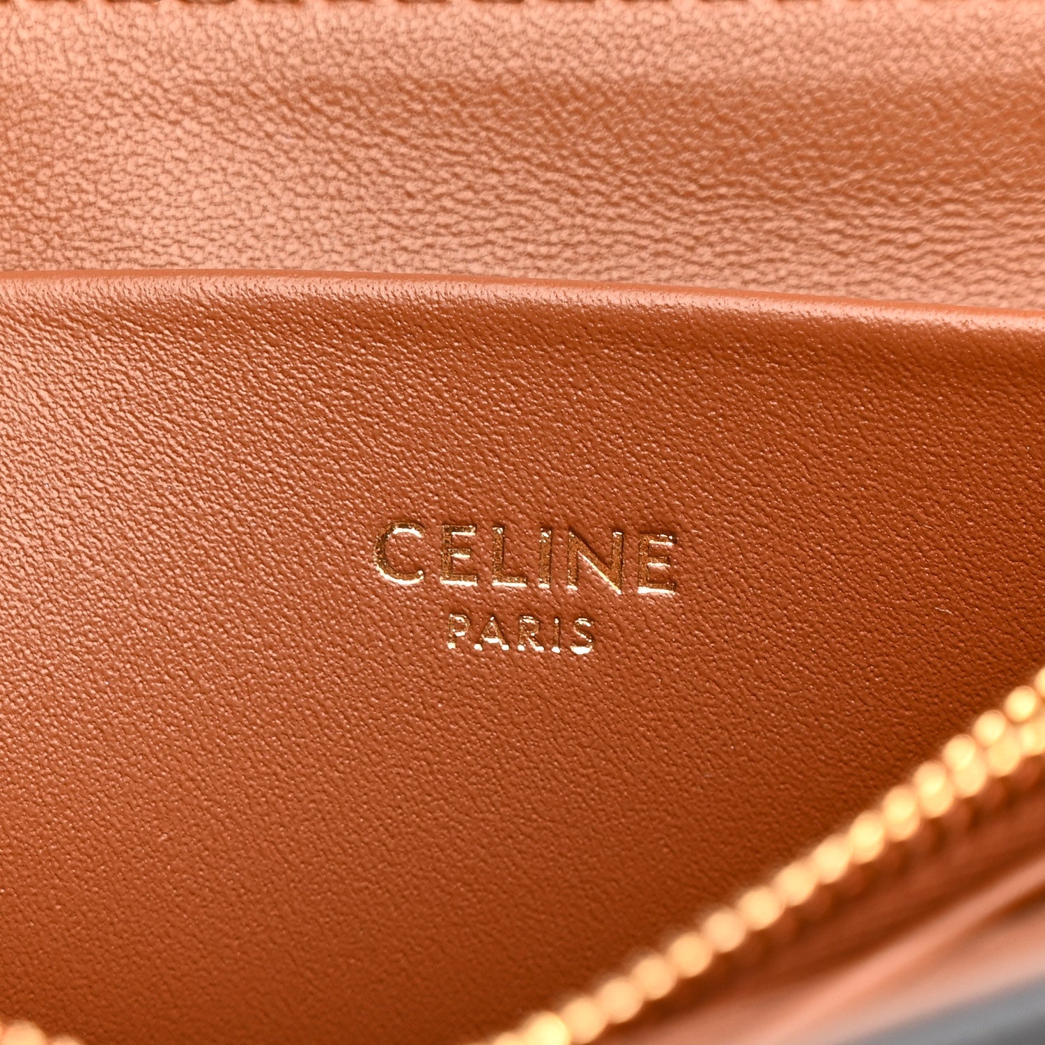 Celine Triomphe shoulder bag close-up of tan interior leather with “CELINE PARIS” stamp