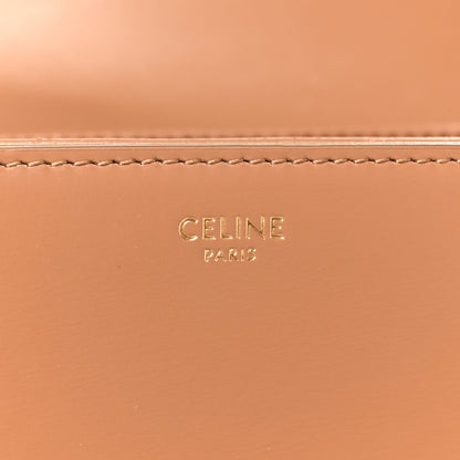 Bronze leather panel with CELINE PARIS embossed logo and contrast stitching