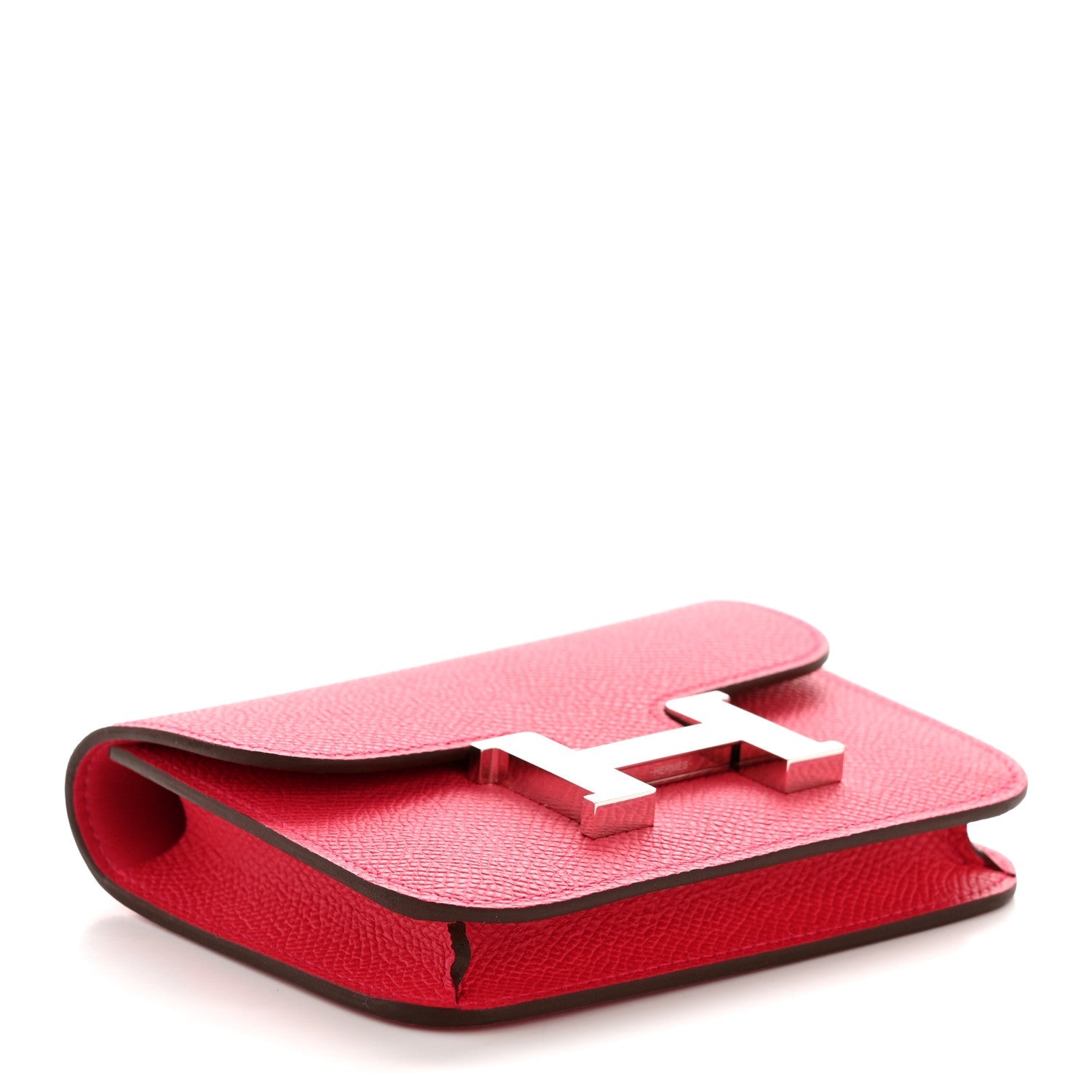 Hermes slim wallet in rose red textured leather, side profile with folded flap