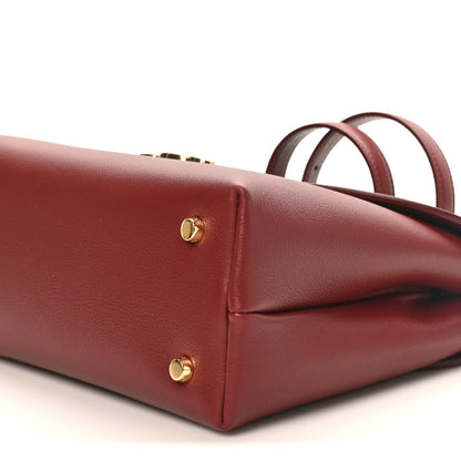 Celine burgundy grained leather bag side with gold studs and top handle
