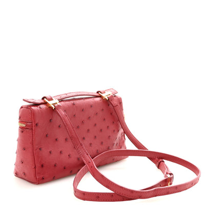 Loro Piana ostrich pouch fuchsia with top zip, crossbody strap, structured shape