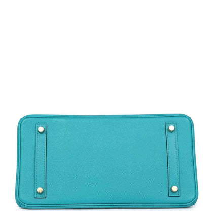 Timeless turquoise leather handbag base with gold accents, sophisticated and elegant style.