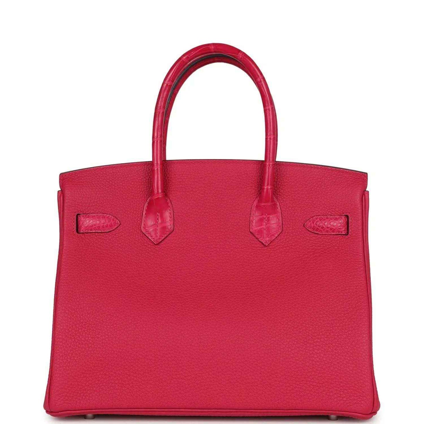 Timeless, elegant red leather tote handbag with structured shape and refined detailing.